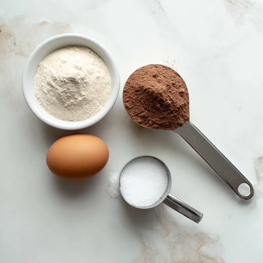 Flat lay of protein mug cake ingredients including protein powder, egg, sweetener, and baking powder