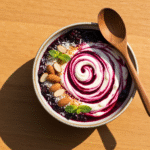 High protein Greek yogurt bowl with blackberry compote and toppings