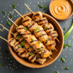 Bang Bang Chicken Skewers 8 Bang Bang Chicken Skewers with creamy spicy sauce and green onions
