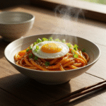 Steaming spicy chili udon noodles with egg and scallions