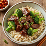 Crock Pot Beef and Broccoli served over brown rice.