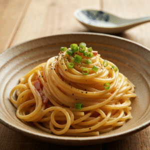 Creamy Japanese miso carbonara pasta with bacon and green onions.