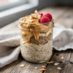 Healthy banana bread overnight oats in a glass jar with banana and walnuts.
