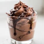 Creamy Baileys chocolate mousse with whipped cream and cocoa powder.