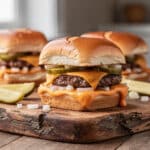 Copycat Big Mac Sliders with melted cheese and special sauce on Hawaiian rolls.