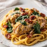 Creamy Tuscan chicken recipe with sun dried tomatoes and spinach.