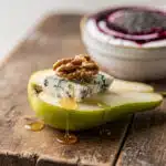 Healthy snack board with fresh vegetables hummus nuts and energy balls