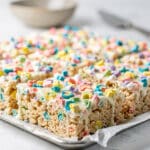 Colorful Lucky Charms Rice Krispie Treats with marshmallow and crispy cereal.