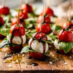 Mini Caprese Skewers recipe with fresh tomatoes, mozzarella, and basil.