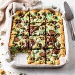 Mint chocolate chip cookie bars are thick chewy and fudgy with melty chocolate chips