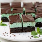 Fresh mint chocolate cookie bars with creamy green frosting and chocolate ganache layers.