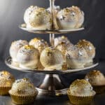 Festive New Years Eve cake ball drops with gold and silver sprinkles.