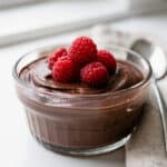 Decadent raspberry chocolate mousse dessert with fresh berries and creamy texture.