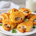 Savory sausage and cream cheese filled crescent bites with flaky golden pastry.