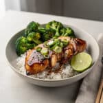 Sticky chicken rice bowls with broccoli and green onions for dinner.