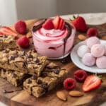 Valentine's dessert board with healthy yogurt parfait and protein cookie bars
