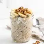 Creamy banana bread protein overnight oats in a clear mason jar