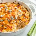 Creamy buffalo chicken dip with cheddar and blue cheese crumbles.