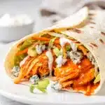 Buffalo chicken wrap with crispy lettuce, carrot, and creamy ranch dressing.