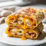 Cheesy garlic chicken wraps with crispy tortillas and melted cheese filling