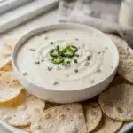 Creamy homemade queso blanco dip with jalapeño and cilantro for dipping chips