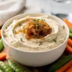 Creamy homemade French onion dip with caramelized onions and fresh chives.