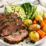 Slow cooker corned beef cabbage recipe with tender brisket and vegetables.