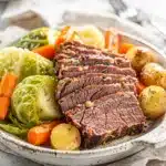Tender slow cooker corned beef and cabbage with potatoes carrots and parsley