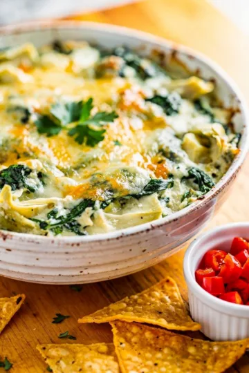 Creamy homemade spinach artichoke dip recipe with vibrant fresh ingredients.