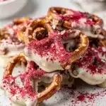 Sweet and salty strawberry chocolate covered pretzels with pink dusting and sea salt.