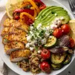 Colorful chicken and quinoa bowl with avocado and roasted vegetables recipe