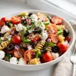 Colorful classic Italian pasta salad with mozzarella olives and tangy vinaigrette dressing