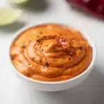 Creamy chipotle mayo recipe with a smoky kick and vibrant orange red color