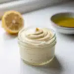 Creamy homemade olive oil mayonnaise recipe with vibrant natural lighting