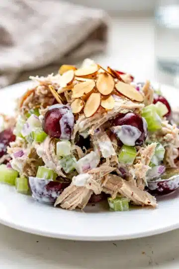 Creamy Greek yogurt chicken salad with red grapes almonds and celery