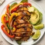 Colorful sheet pan chicken fajitas with peppers and onions ready to serve