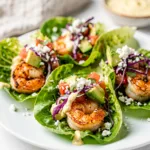 Juicy shrimp taco lettuce wraps with avocado and lime sauce