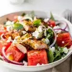Juicy watermelon and creamy feta chicken salad for a fresh summer meal.
