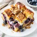 Baked blueberry cream cheese French toast bake with golden crumb topping