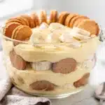 Easy banana pudding recipe in a clear glass trifle bowl with perfect creamy layers.