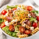 Creamy BLT Ranch Pasta Salad with bacon, tomatoes, lettuce, and cheese.