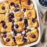 Easy blueberry cream cheese French toast bake slice on a white plate.