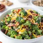 Chopped broccoli bacon salad with cranberries and cheese in creamy dressing