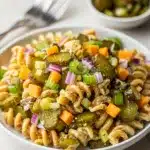 Creamy dill pickle pasta salad with crunchy celery and cheddar cheese