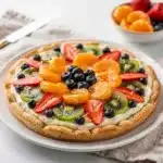 Easy classic fruit pizza with cream cheese and fresh fruit on cookie crust
