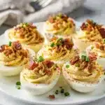 Creamy bacon ranch deviled eggs recipe with crispy bacon and chive garnish
