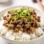 Creamy Korean ground beef bowl with glossy sauce over fluffy white rice