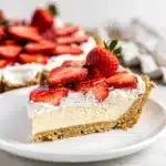Creamy no bake strawberry pie with a buttery crumb crust and glossy filling