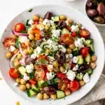 Crisp Mediterranean chickpea salad with feta and fresh colorful vegetables.