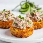 Crispy rice tuna bites with avocado and spicy mayo on white plate